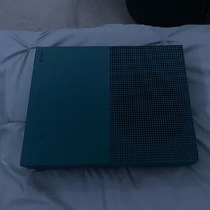 Xbox One S with HDMI cord and power cable.